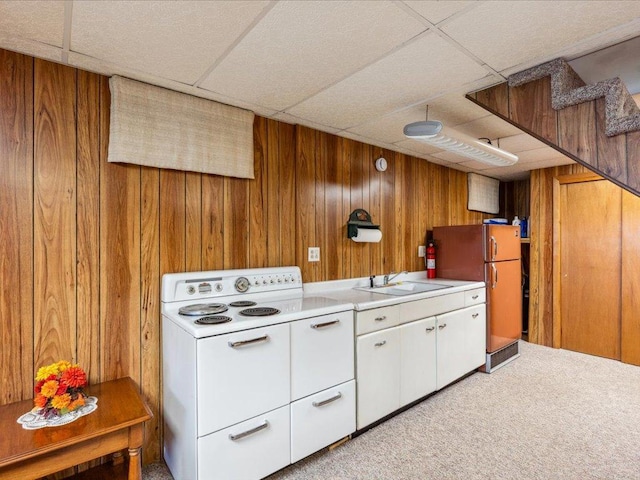 1474 Shamineau Dr, Motley, MN 56466 - kitchen with a paneled ceiling, light countertops, carpet flooring, wood walls, and freestanding refrigerator