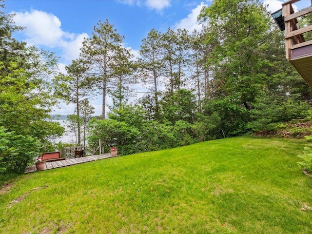 1474 Shamineau Dr, Motley, MN 56466 - view of grassy yard featuring a wooden deck
