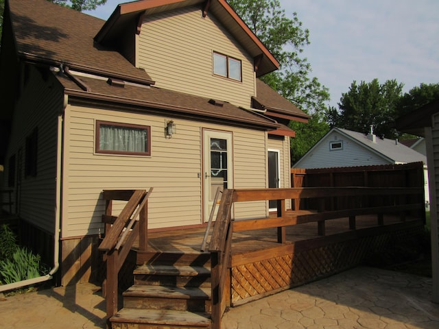 457 Rohrer St, Round Lake, MN 56167 - rear view of property featuring a wooden deck and a shingled roof