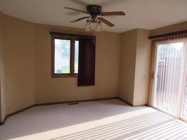 457 Rohrer St, Round Lake, MN 56167 - empty room featuring light colored carpet, ceiling fan, and baseboards
