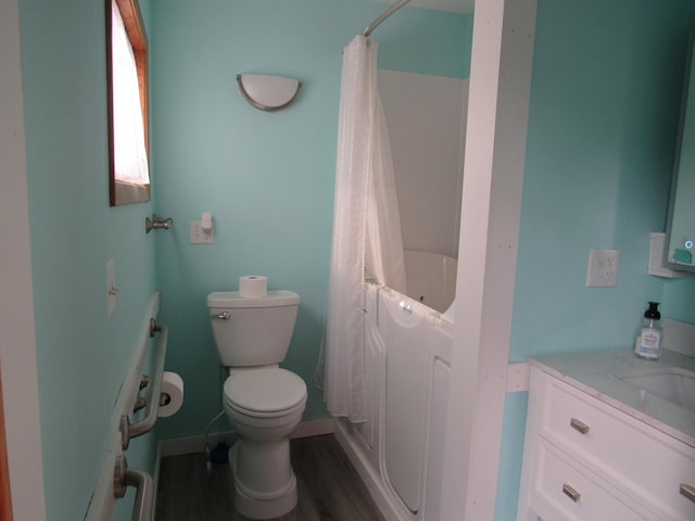 457 Rohrer St, Round Lake, MN 56167 - full bathroom with vanity, wood finished floors, toilet, shower / bathtub combination with curtain, and baseboards
