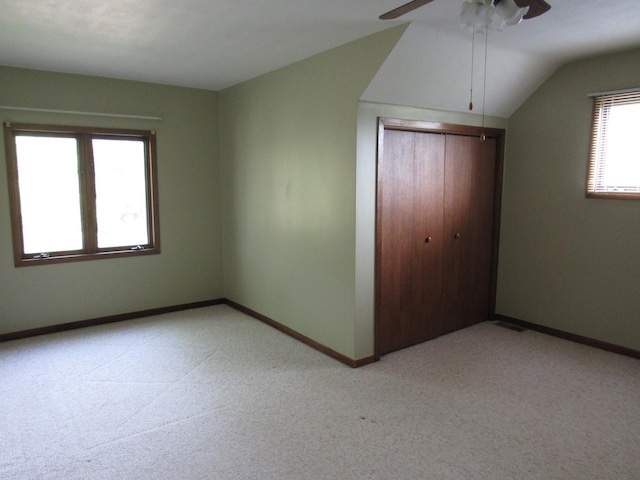 457 Rohrer St, Round Lake, MN 56167 - unfurnished bedroom featuring light colored carpet, a closet, baseboards, and lofted ceiling