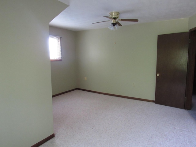 457 Rohrer St, Round Lake, MN 56167 - spare room featuring a ceiling fan, baseboards, and light carpet