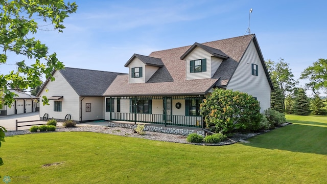 18000 10th St SW, Hawley, MN 56549 - view of front of home with a shingled roof, a front yard, and a porch