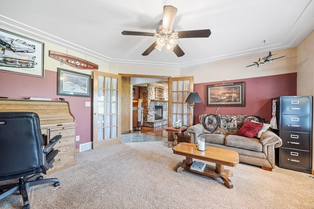 18000 10th St SW, Hawley, MN 56549 - carpeted living room featuring a desk, ceiling fan, and a stone fireplace