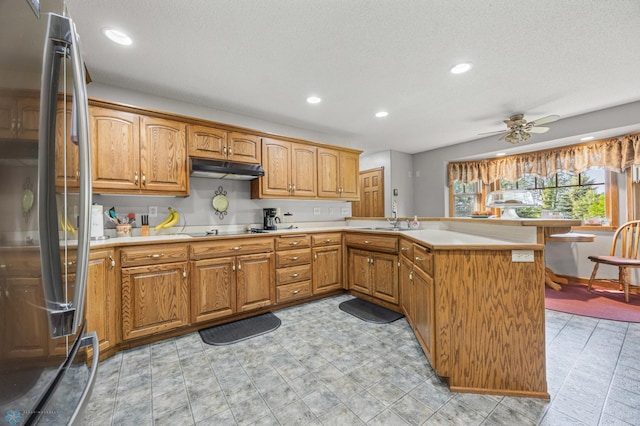 18000 10th St SW, Hawley, MN 56549 - kitchen with freestanding refrigerator, black electric cooktop, a peninsula, light countertops, and recessed lighting