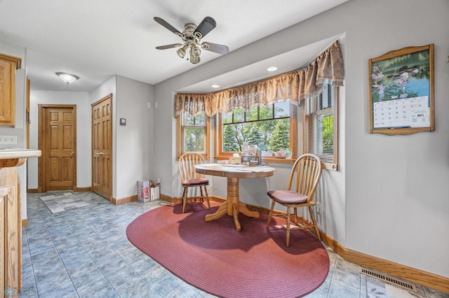 18000 10th St SW, Hawley, MN 56549 - dining area with baseboards and ceiling fan