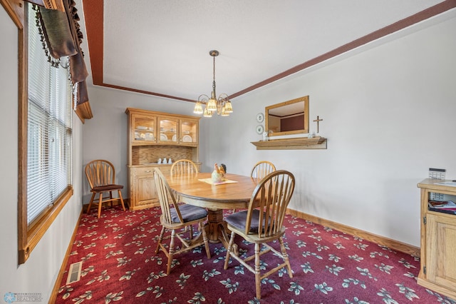 18000 10th St SW, Hawley, MN 56549 - carpeted dining area with baseboards and a chandelier
