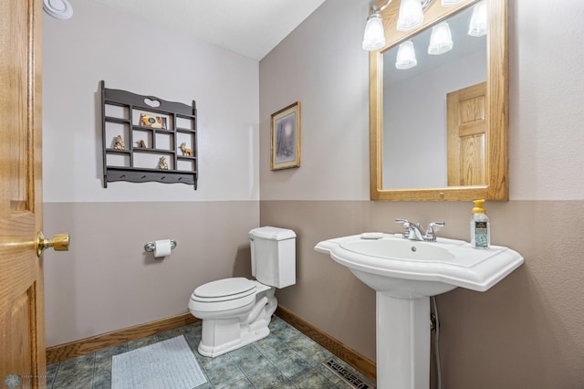 18000 10th St SW, Hawley, MN 56549 - half bath featuring toilet and baseboards