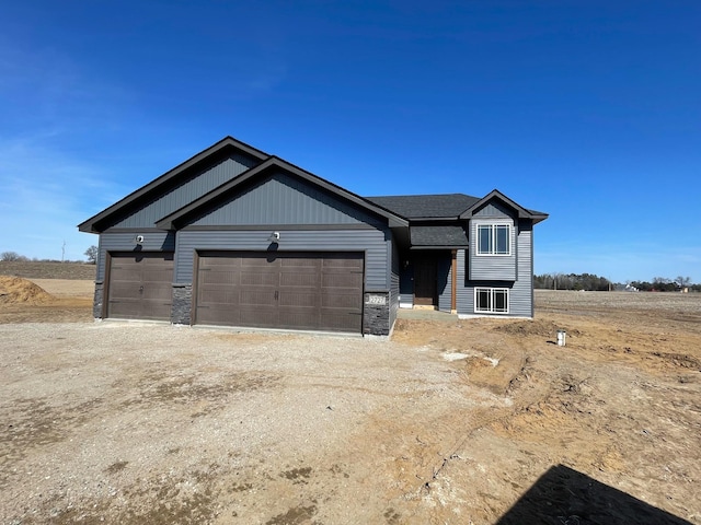 32755 Naples St NE, Cambridge, MN 55008 - view of front facade with a garage and driveway