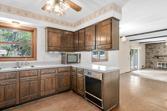 8200 77th St S, Cottage Grove, MN 55016 - kitchen featuring ceiling fan, healthy amount of natural light, stainless steel microwave, a peninsula, and beam ceiling