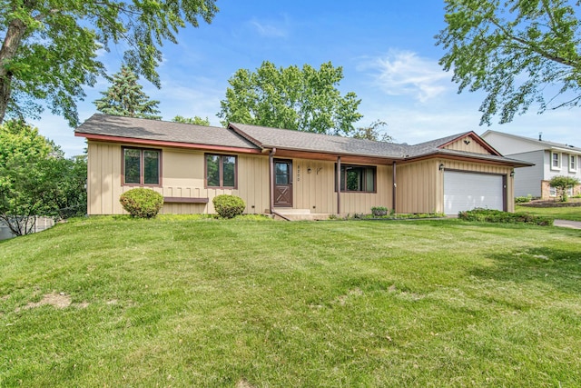 8200 77th St S, Cottage Grove, MN 55016 - ranch-style house with an attached garage, a front yard, board and batten siding, and a shingled roof