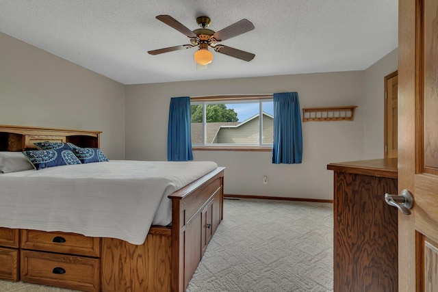 1506 6th Ave N, Sartell, MN 56377 - bedroom featuring light carpet, baseboards, ceiling fan, and a textured ceiling