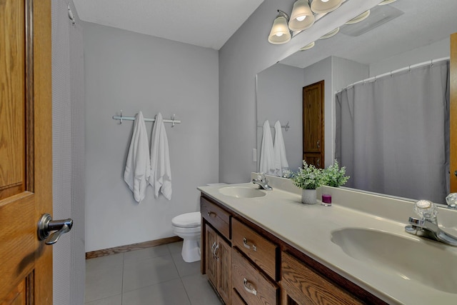 1506 6th Ave N, Sartell, MN 56377 - full bath with double vanity, toilet, tile patterned floors, baseboards, and a shower with curtain