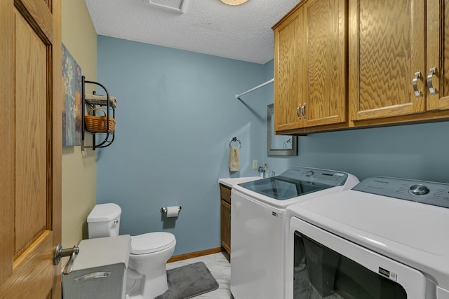 1506 6th Ave N, Sartell, MN 56377 - laundry room with washing machine and clothes dryer, baseboards, and a textured ceiling