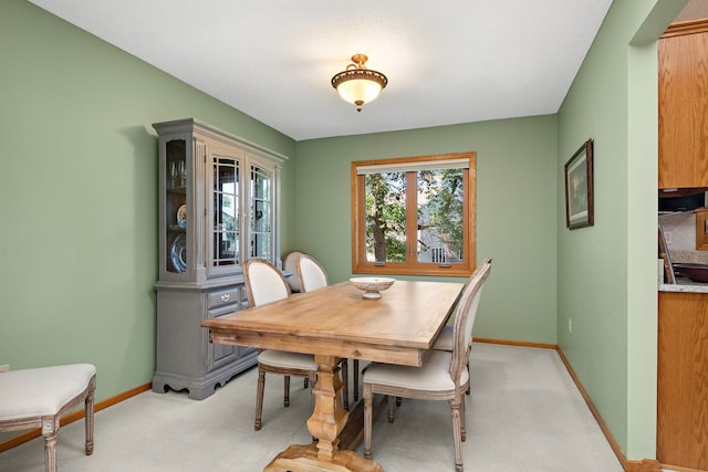 8909 Vickors Xing, Brooklyn Park, MN 55443 - dining room with light colored carpet and baseboards
