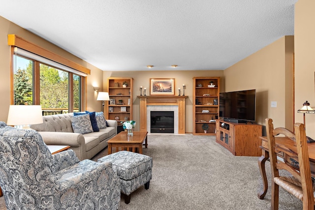 8909 Vickors Xing, Brooklyn Park, MN 55443 - carpeted living room featuring a tile fireplace and a textured ceiling