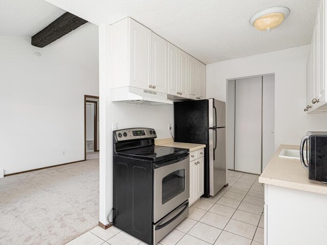 4600 Cedar Lake Rd S Unit 6, Saint Louis Park, MN 55416 - kitchen featuring appliances with stainless steel finishes, under cabinet range hood, white cabinetry, light countertops, and a textured ceiling