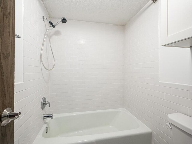 4600 Cedar Lake Rd S Unit 6, Saint Louis Park, MN 55416 - bathroom featuring a textured ceiling,  shower combination, and tile walls