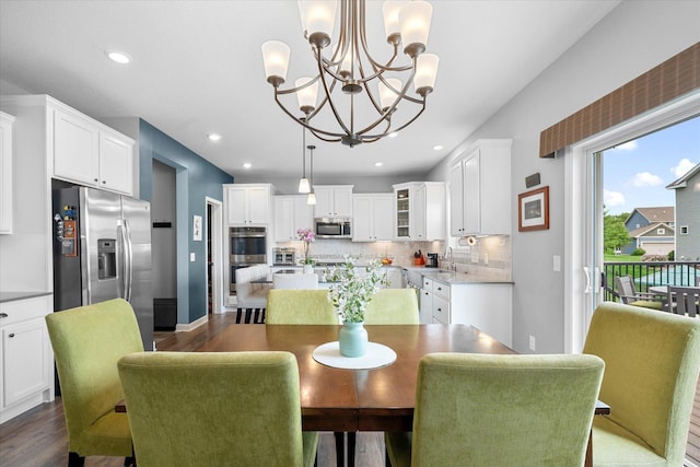 11444 Creekside Ct, Rogers, MN 55311 - dining area with a chandelier, dark wood-style floors, and recessed lighting