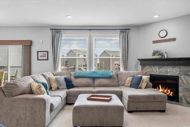 11444 Creekside Ct, Rogers, MN 55311 - living room featuring light colored carpet, a fireplace, and recessed lighting