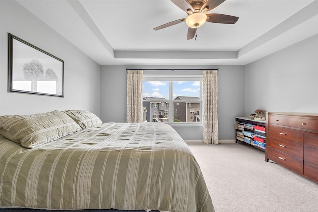 11444 Creekside Ct, Rogers, MN 55311 - bedroom featuring light carpet, a tray ceiling, ceiling fan, and baseboards