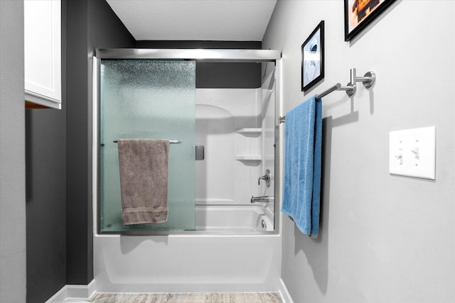 11444 Creekside Ct, Rogers, MN 55311 - full bath featuring bath / shower combo with glass door and baseboards