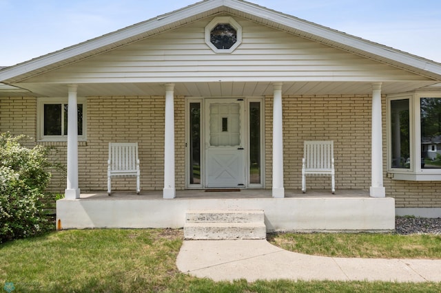 1311 Joseph St, Hawley, MN 56549 - doorway to property featuring a porch and brick siding