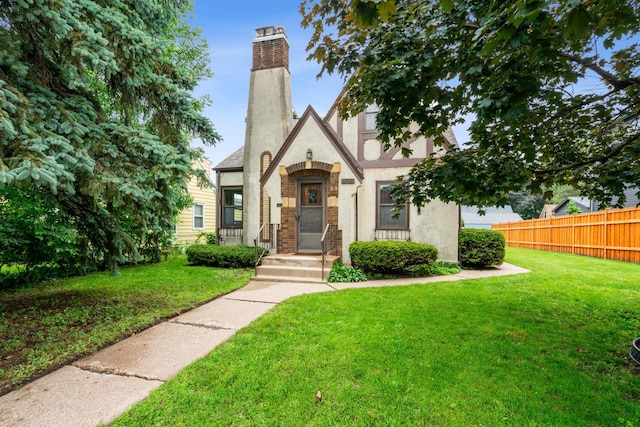 5705 36th Ave S, Minneapolis, MN 55417 - tudor-style house with stucco siding and a chimney