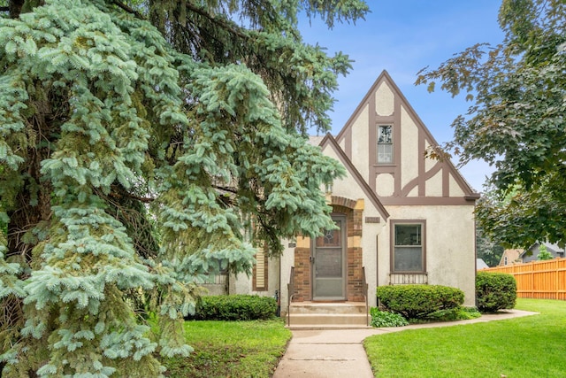5705 36th Ave S, Minneapolis, MN 55417 - tudor-style house with stucco siding