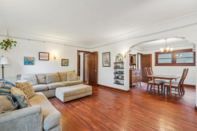 5705 36th Ave S, Minneapolis, MN 55417 - living area featuring a chandelier, wood finished floors, arched walkways, and ornamental molding