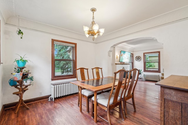5705 36th Ave S, Minneapolis, MN 55417 - dining area with radiator heating unit, arched walkways, a chandelier, and healthy amount of natural light