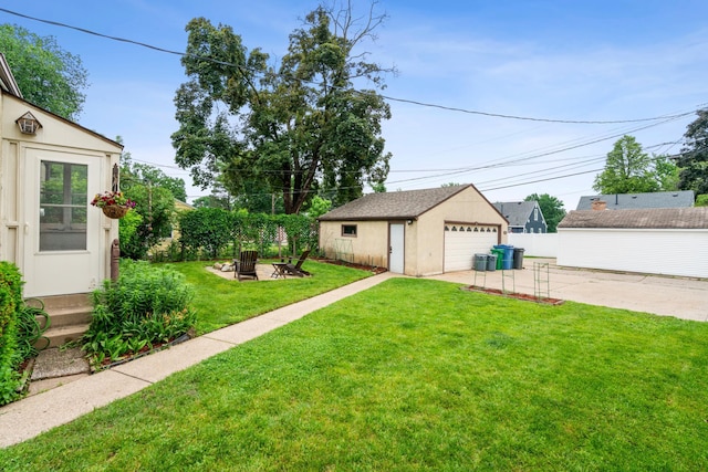 5705 36th Ave S, Minneapolis, MN 55417 - view of yard with a garage, an outbuilding, and an outdoor fire pit