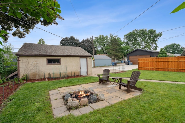 5705 36th Ave S, Minneapolis, MN 55417 - view of yard with a fire pit, a patio, a detached garage, and an outdoor structure