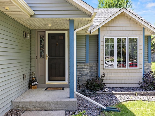 201 3rd St NW, Saint Michael, MN 55376 - doorway to property with a porch and a shingled roof