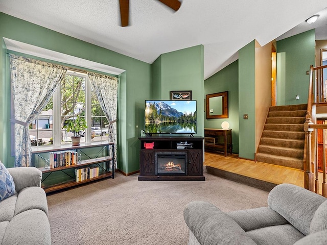 201 3rd St NW, Saint Michael, MN 55376 - living room with a ceiling fan, carpet flooring, stairs, and a lit fireplace