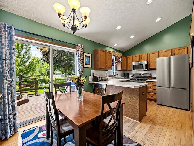 201 3rd St NW, Saint Michael, MN 55376 - dining room with light wood-style flooring, lofted ceiling, a chandelier, a textured ceiling, and recessed lighting