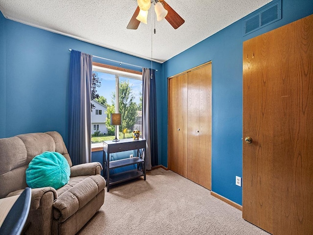 201 3rd St NW, Saint Michael, MN 55376 - sitting room featuring ceiling fan, carpet floors, and a textured ceiling
