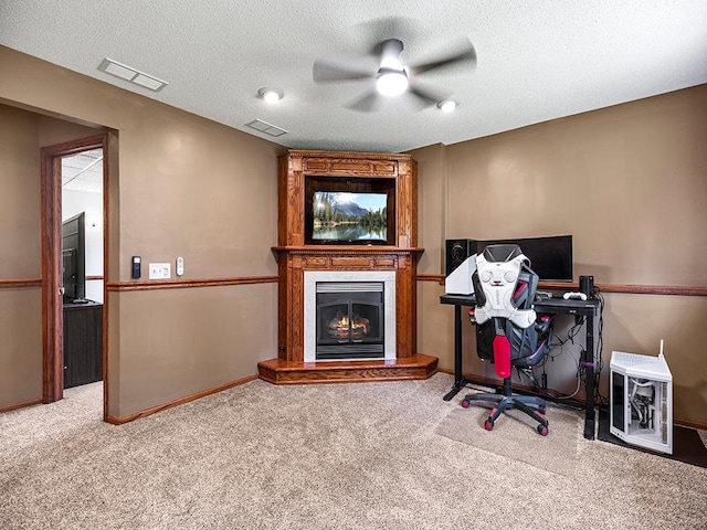 201 3rd St NW, Saint Michael, MN 55376 - carpeted home office with a ceiling fan, a warm lit fireplace, and a textured ceiling