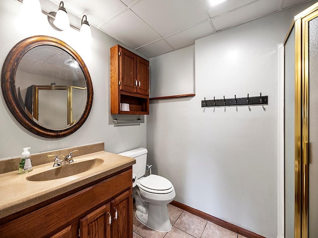201 3rd St NW, Saint Michael, MN 55376 - bathroom featuring a drop ceiling, tile patterned floors, vanity, and a shower with shower door