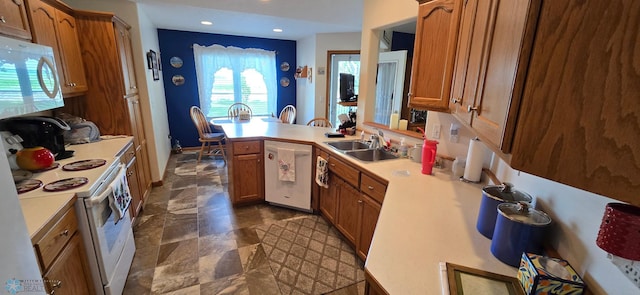 4708 21st St N, Moorhead, MN 56560 - kitchen with white appliances, a sink, light countertops, brown cabinets, and recessed lighting
