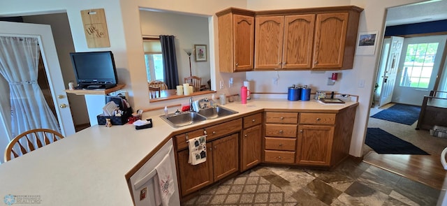 4708 21st St N, Moorhead, MN 56560 - kitchen featuring a sink, light countertops, and brown cabinetry