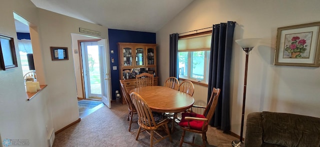 4708 21st St N, Moorhead, MN 56560 - dining area with vaulted ceiling, carpet, and baseboards