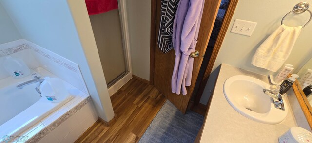 4708 21st St N, Moorhead, MN 56560 - full bath with a shower stall, a garden tub, wood finished floors, and vanity