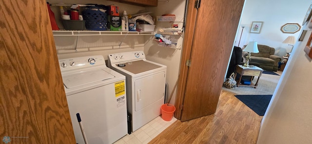4708 21st St N, Moorhead, MN 56560 - laundry room with washer and clothes dryer and light wood-type flooring