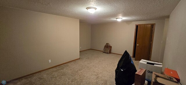 4708 21st St N, Moorhead, MN 56560 - unfurnished room with carpet, baseboards, and a textured ceiling