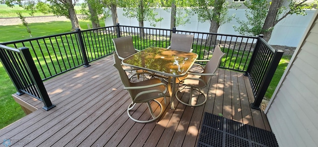 4708 21st St N, Moorhead, MN 56560 - wooden terrace featuring outdoor dining area and a yard