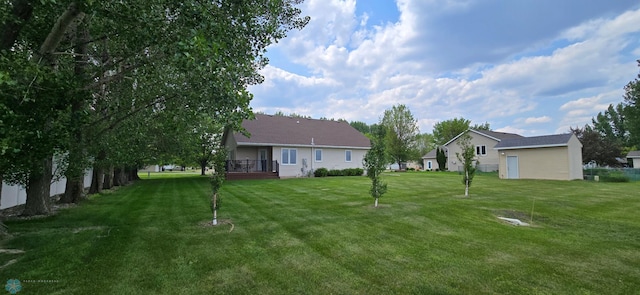 4708 21st St N, Moorhead, MN 56560 - view of grassy yard with a wooden deck