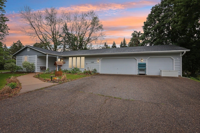 1985 Mabel Ct, Chaska, MN 55318 - view of front of home with a garage and asphalt driveway