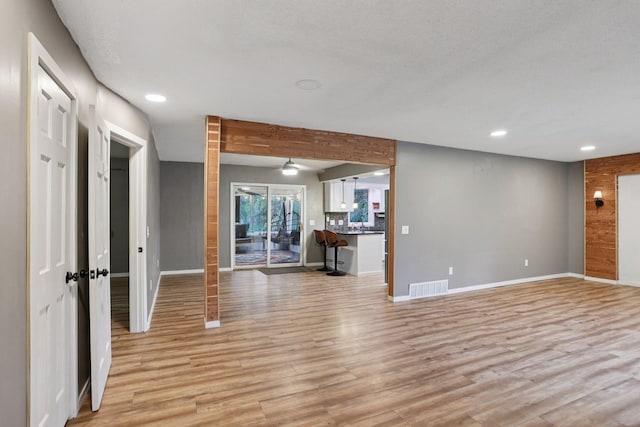 1985 Mabel Ct, Chaska, MN 55318 - unfurnished living room featuring light wood-style flooring and recessed lighting